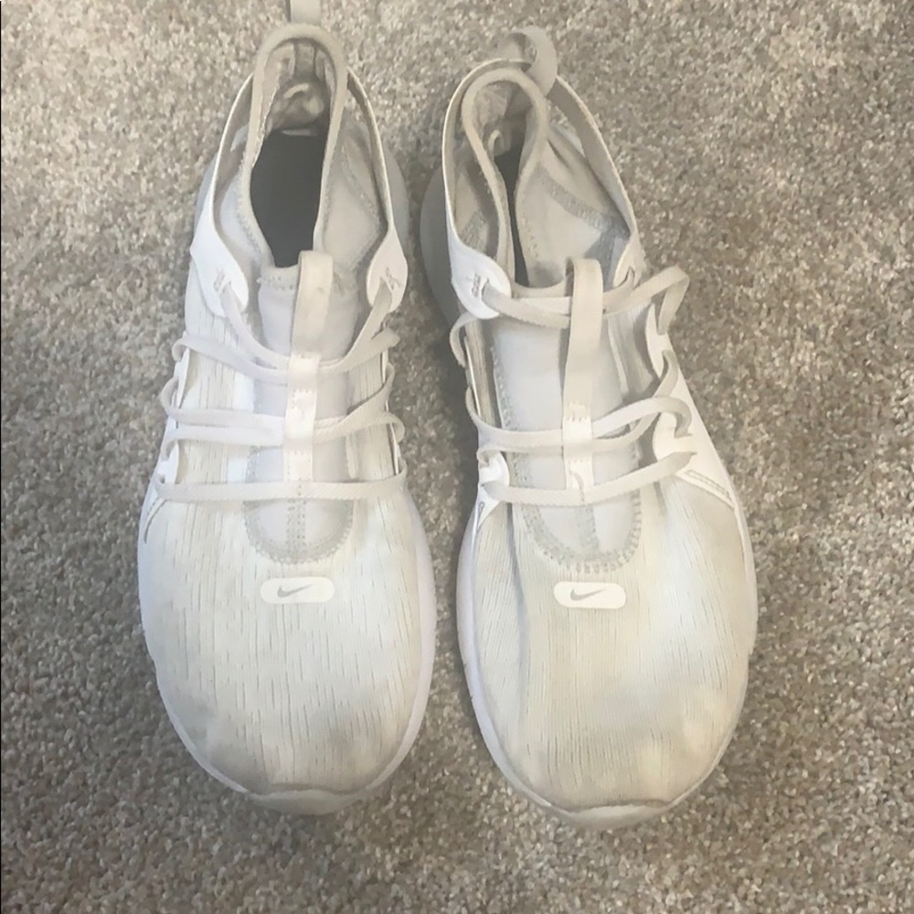 White Nike running shoes